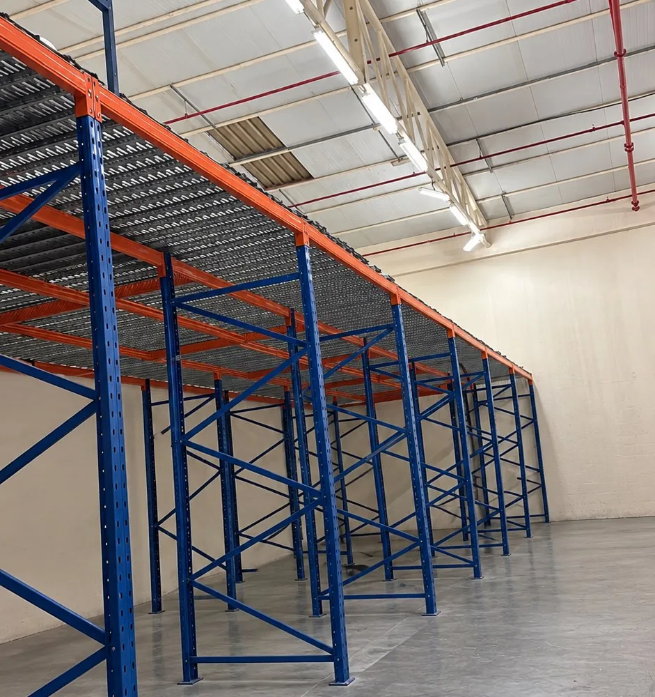 Racking mezzanine floor with steel deck above pallet racks in a UAE warehouse